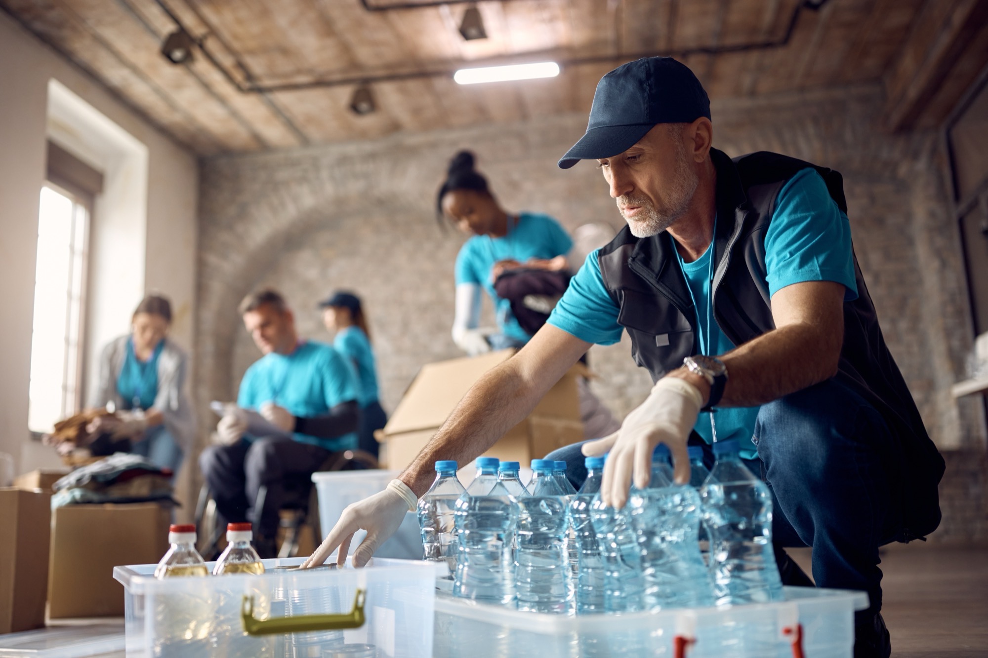Volunteers organizing community resources — the human work behind verified directory data