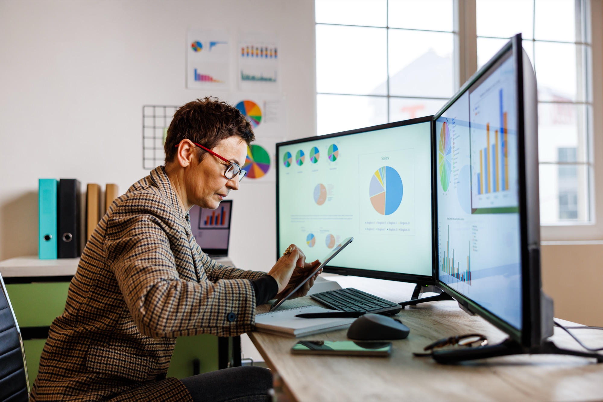 An analyst reviewing duplicate program data across multiple dashboards