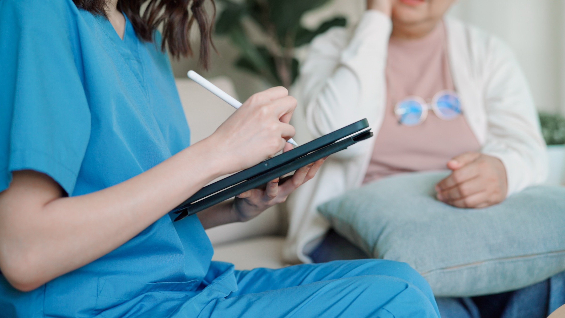 A care worker reviewing community resource information with a client